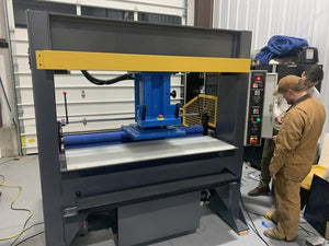 Trak Series traveling head press with operator
