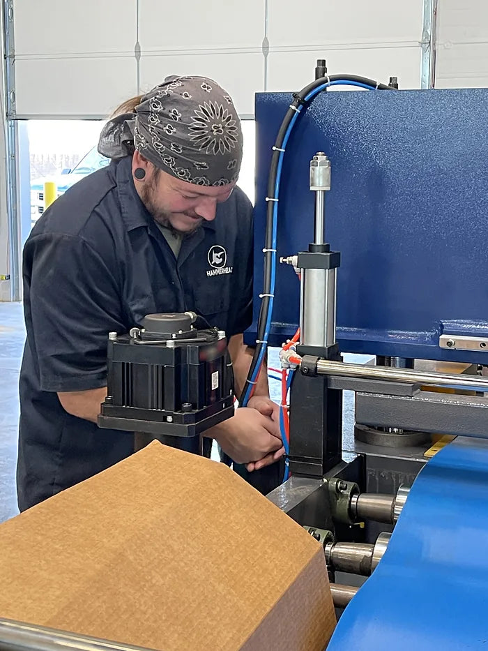 Hammerhead technician wiring a servo actuator on a machine in our Payson, Utah shop